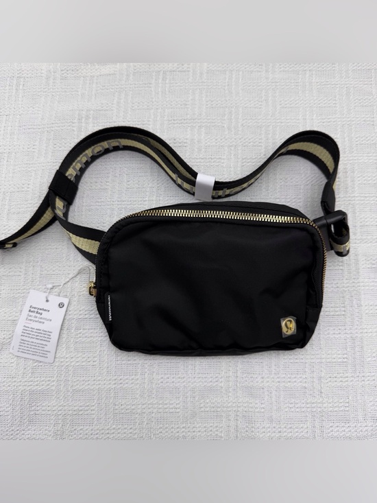 lululemon athletica Handbags - Lululemon Everywhere Crossbody Belt Bag Wordmark Black/Gold